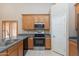 Kitchen with stainless steel appliances, granite countertops, and wood cabinets at 11419 E Ellis St, Mesa, AZ 85207
