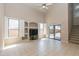 Spacious living room with tile flooring, bright windows, and backyard access at 11419 E Ellis St, Mesa, AZ 85207