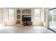 A view of a living room that boasts bright windows and built-in shelves at 11419 E Ellis St, Mesa, AZ 85207
