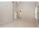 Open living space with tile flooring, high ceilings, and natural light at 11419 E Ellis St, Mesa, AZ 85207