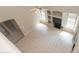 Living room with tiled floor, bright windows, and built-in shelves at 11419 E Ellis St, Mesa, AZ 85207