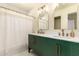 Chic bathroom with dual sinks, decorative mirrors, and a modern shower at 1421 E Charleston Ave, Phoenix, AZ 85022