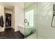 Bright primary bathroom features soaking tub and walk-in shower with subway tile and glass surround at 1421 E Charleston Ave, Phoenix, AZ 85022
