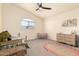 Bright bedroom featuring a vaulted ceiling, window, and neutral carpet at 1421 E Charleston Ave, Phoenix, AZ 85022