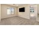 Sunlit bedroom with neutral carpet and an expansive view from a large window at 1421 E Charleston Ave, Phoenix, AZ 85022