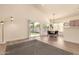 Inviting dining area with modern lighting, access to the backyard, and a stylish table set for Gathering meals at 1421 E Charleston Ave, Phoenix, AZ 85022