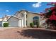 View of home's facade showcasing a driveway and partial view of the front yard at 1421 E Charleston Ave, Phoenix, AZ 85022