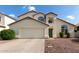 Charming two-story home with a two-car garage, well-maintained landscaping, and inviting curb appeal at 1421 E Charleston Ave, Phoenix, AZ 85022