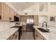 Spacious kitchen with stainless steel appliances, white countertops, and light wood cabinets at 1421 E Charleston Ave, Phoenix, AZ 85022