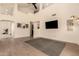 Open living space with sleek flooring, high ceilings, modern lighting, and stylish decor accents at 1421 E Charleston Ave, Phoenix, AZ 85022
