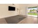 Bright living space with hardwood floors and a large sliding glass door with access to the backyard at 1421 E Charleston Ave, Phoenix, AZ 85022