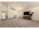 Spacious living room with plush carpeting, vaulted ceilings, and a large window, creating a bright and airy atmosphere at 1421 E Charleston Ave, Phoenix, AZ 85022