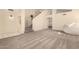 Spacious living room with plush carpeting, vaulted ceilings, and a staircase leading upstairs at 1421 E Charleston Ave, Phoenix, AZ 85022