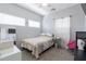 Bright bedroom features a large window, carpet, bed and a ceiling fan at 1461 W Brangus Way, San Tan Valley, AZ 85143