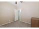 Neutral carpeted bedroom has walk in closet and ceiling fan at 1461 W Brangus Way, San Tan Valley, AZ 85143