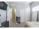 Carpeted bedroom features a large closet, shelves, and ceiling fan at 1461 W Brangus Way, San Tan Valley, AZ 85143