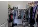 Walk-in closet with shelving and racks for organized storage solutions to maximize space at 1461 W Brangus Way, San Tan Valley, AZ 85143