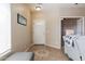 Inviting entryway featuring tile flooring, front door with decorative glass, and neutral paint at 1461 W Brangus Way, San Tan Valley, AZ 85143