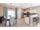 Bright kitchen featuring stainless steel appliances, white cabinets and dining area at 1461 W Brangus Way, San Tan Valley, AZ 85143