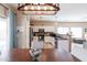 Eat-in kitchen with stainless steel appliances, white cabinetry, granite countertops, and natural light at 1461 W Brangus Way, San Tan Valley, AZ 85143