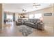 Spacious living room with tile floors and a seamless flow into the kitchen and dining areas at 1461 W Brangus Way, San Tan Valley, AZ 85143