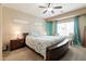 Inviting primary bedroom with a comfortable bed, soft lighting, and relaxing ambiance at 1461 W Brangus Way, San Tan Valley, AZ 85143