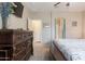 Spacious primary bedroom featuring a large dresser, neutral walls, and a ceiling fan at 1461 W Brangus Way, San Tan Valley, AZ 85143