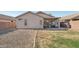 Backyard with gravel and small grass section, perfect for adding your personal touch to outdoor living at 15453 W Shangri La Rd, Surprise, AZ 85379