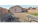 Large backyard with a fire pit, gravel, and low maintenance landscaping perfect for entertaining friends at 15453 W Shangri La Rd, Surprise, AZ 85379
