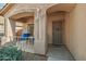 Close up view of the front porch with an outdoor seating area and shade at 15453 W Shangri La Rd, Surprise, AZ 85379