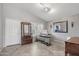 Well-lit home office featuring a large window, tile floors, and ample workspace at 15453 W Shangri La Rd, Surprise, AZ 85379