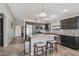 Spacious kitchen with a central island, stainless steel appliances, and modern countertops at 15453 W Shangri La Rd, Surprise, AZ 85379