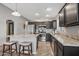 Modern kitchen with an island, stainless steel appliances, and ample counter space for cooking at 15453 W Shangri La Rd, Surprise, AZ 85379