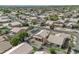 An aerial view of a suburban neighborhood featuring a mix of single-story homes and manicured streets at 15470 W Mauna Loa Ln, Surprise, AZ 85379