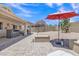 The spacious backyard is designed for outdoor living with a patio, BBQ area, and easy-care desert landscaping at 15470 W Mauna Loa Ln, Surprise, AZ 85379