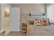 Comfortable bedroom with a decorative headboard and bedding, and plantation shutters for soft, natural light at 15470 W Mauna Loa Ln, Surprise, AZ 85379