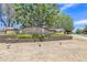 Welcoming neighborhood entrance with beautiful landscaping and a charming 'Countryside' sign at 15470 W Mauna Loa Ln, Surprise, AZ 85379