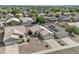Aerial view of a single-story home with a desert landscape and a two-car garage at 15470 W Mauna Loa Ln, Surprise, AZ 85379