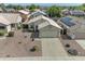 Charming single-story home featuring a two car garage and a low maintenance desert landscape at 15470 W Mauna Loa Ln, Surprise, AZ 85379