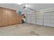 Spacious two car garage with ample storage cabinets and an automatic door opener at 15470 W Mauna Loa Ln, Surprise, AZ 85379