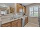 Bright kitchen features wood cabinets, stainless steel appliances, and ample counter space at 15470 W Mauna Loa Ln, Surprise, AZ 85379