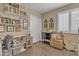 Charming office space with shelving, desk and storage, perfect for working from home at 15470 W Mauna Loa Ln, Surprise, AZ 85379