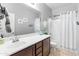 This bathroom features a neutral color palette, modern fixtures, and a bright mirror at 16375 W Cortez St, Surprise, AZ 85388