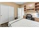 This bedroom features a built-in granite desktop, and custom cabinets with lots of room at 16375 W Cortez St, Surprise, AZ 85388