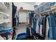 Walk-in closet with ample storage, shelves, and hanging space for organized wardrobe management at 16375 W Cortez St, Surprise, AZ 85388