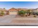 Charming single-Gathering home with a two-car garage and beautifully landscaped front yard at 16375 W Cortez St, Surprise, AZ 85388