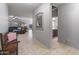 Hallway leading to the living room and bathroom, offering a glimpse of the home's layout at 16375 W Cortez St, Surprise, AZ 85388