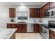 Well-equipped kitchen with granite countertops, stainless steel appliances, and ample cabinet space for storage at 16375 W Cortez St, Surprise, AZ 85388