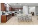 Modern kitchen with granite countertops, stainless steel appliances, and a center island with barstool seating at 16375 W Cortez St, Surprise, AZ 85388