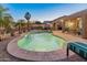 The large swimming pool, lush landscaping, and resort-like amenities create a stunning outdoor oasis at 16375 W Cortez St, Surprise, AZ 85388